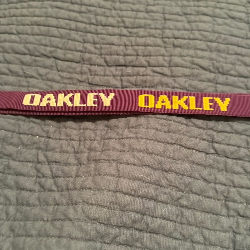 Purple and yellow Oakley lanyard